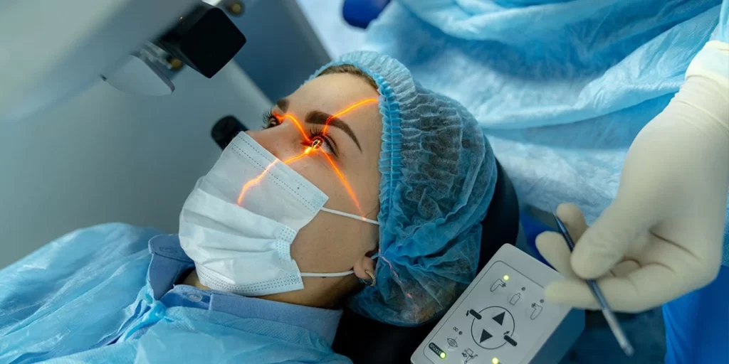 Patient consulting with ophthalmologist about cost of laser treatment for eyes