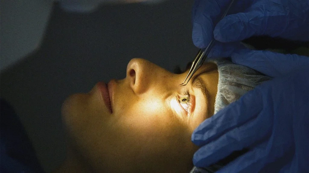 Doctor explaining cost of laser treatment for eyes to a patient before surgery