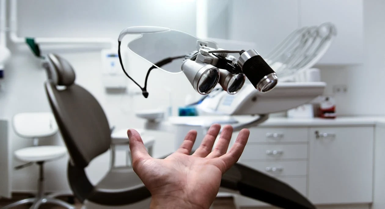 Technician preparing patient for laser eye surgery discussing cost of laser treatment for eyes